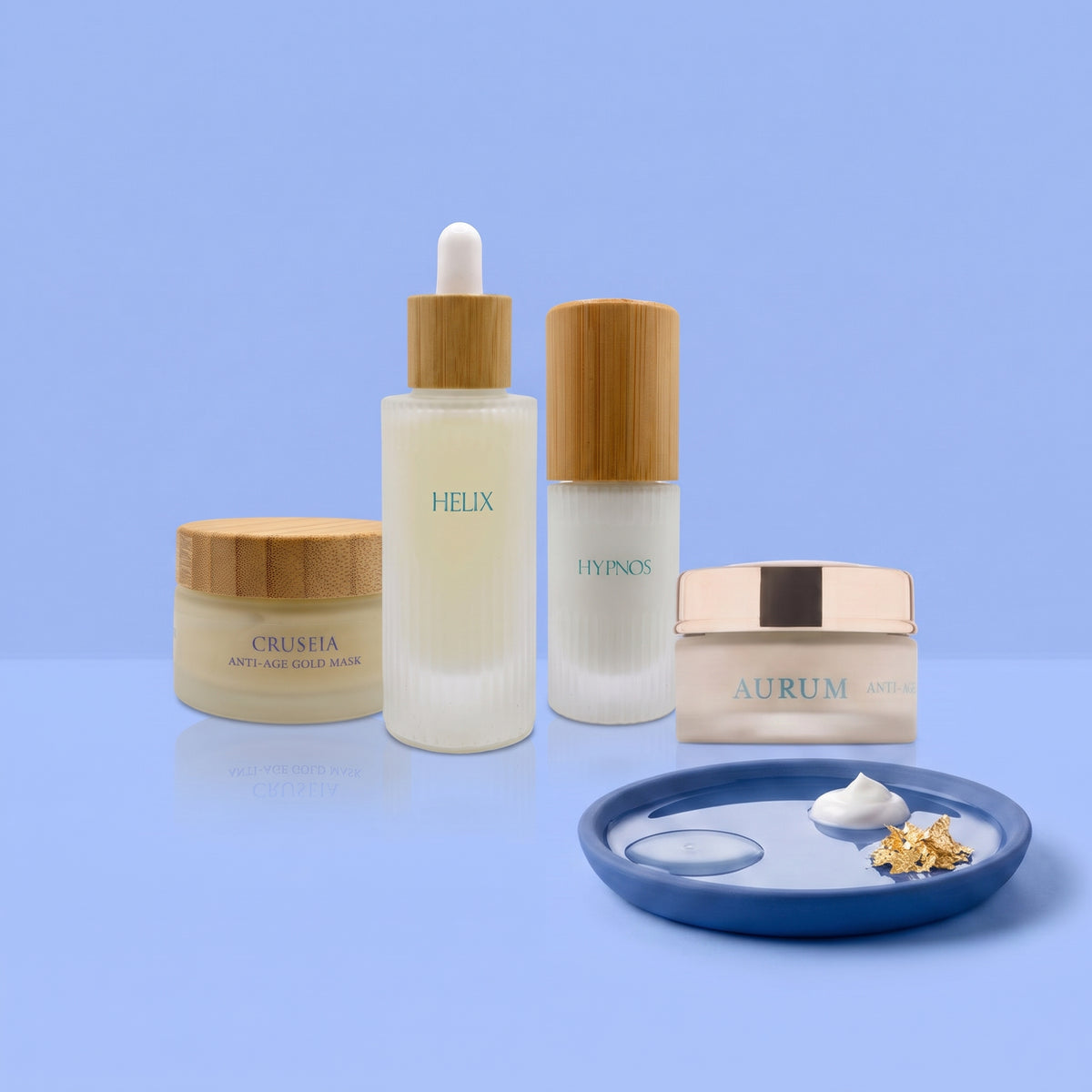 Nymphs Skin Routine per pelli mature: i prodotti del kit su fondo azzurro con piattino